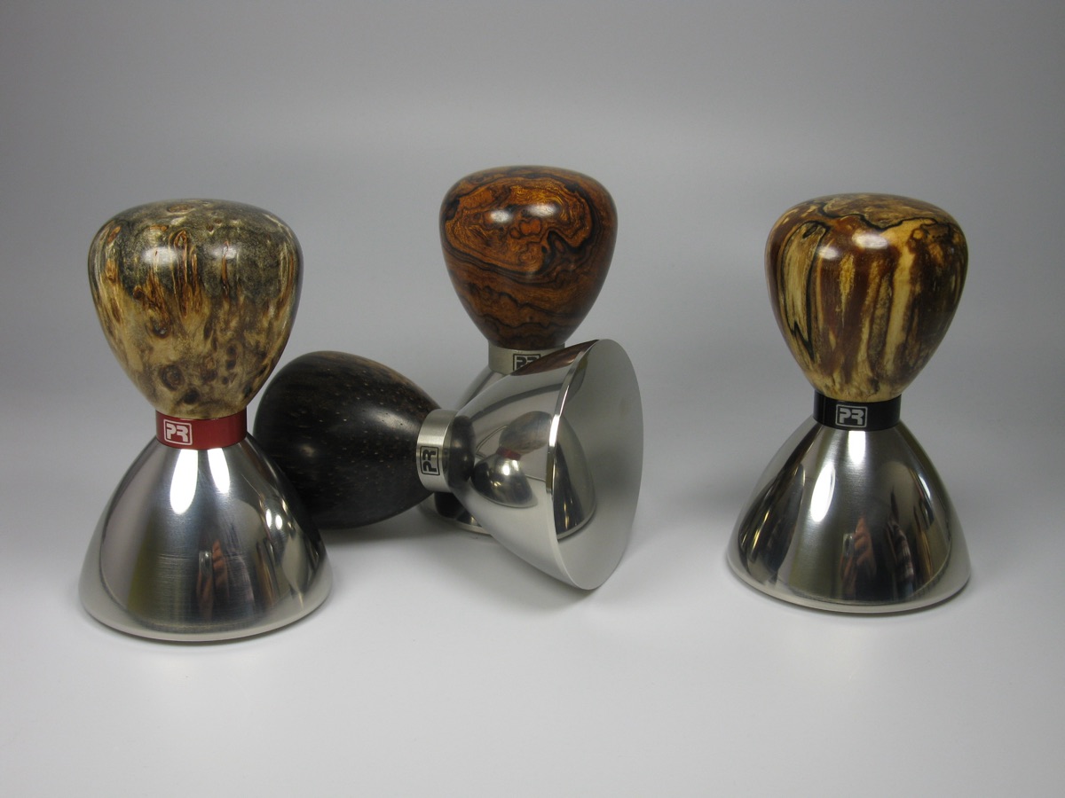 Espresso tamper on a tamping mat